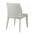 White saddle leather armless dining chairs